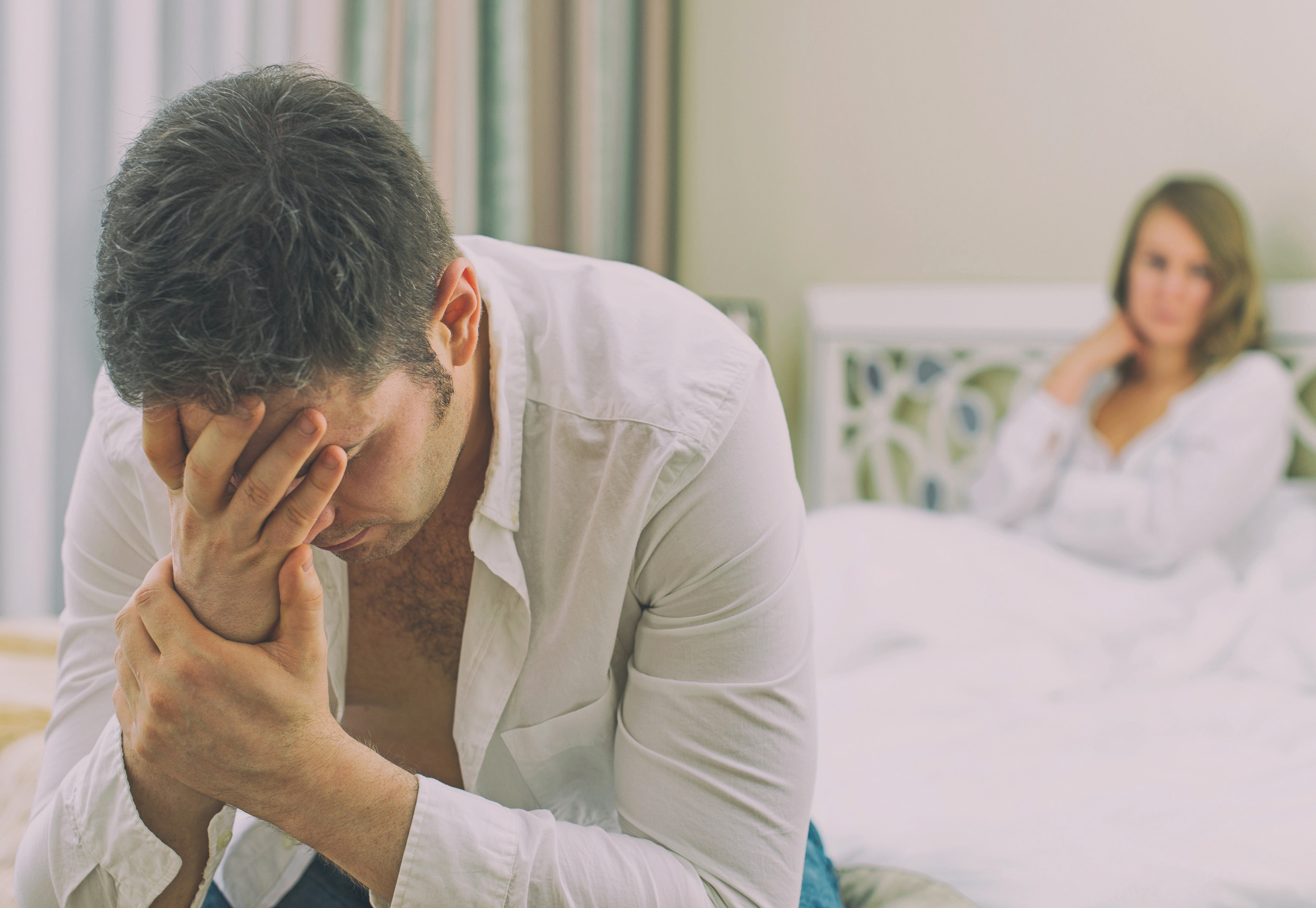 Upset young couple having problems with sex.